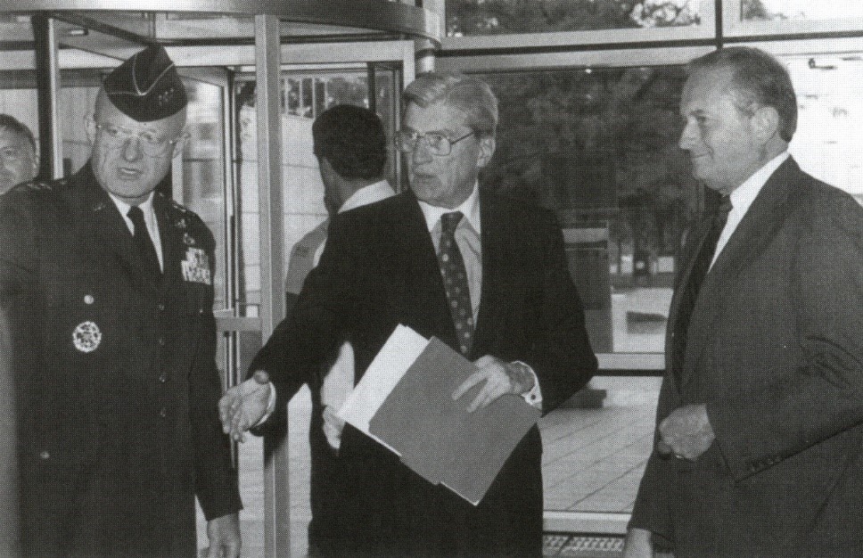 DIA Director Lt. Gen. James Clapper (left) welcomes Senator John Warner (center) to DIA to discuss transformational changes in the Intelligence Community, 1994.